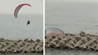 Paraşütçü dalgakıranların üzerine düştü, o anlar kameraya yansıdı