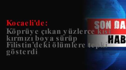 Köprüye çıkan yüzlerce kişi kırmızı boya sürüp Filistin’deki ölümlere tepki gösterdi